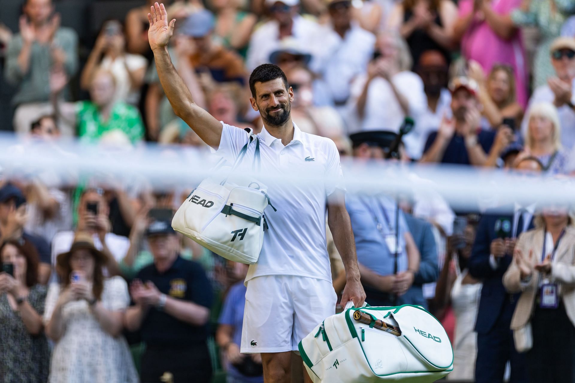 Novak Djokovic waves to Wimbledon crowd after SF loss | Image Source: Getty